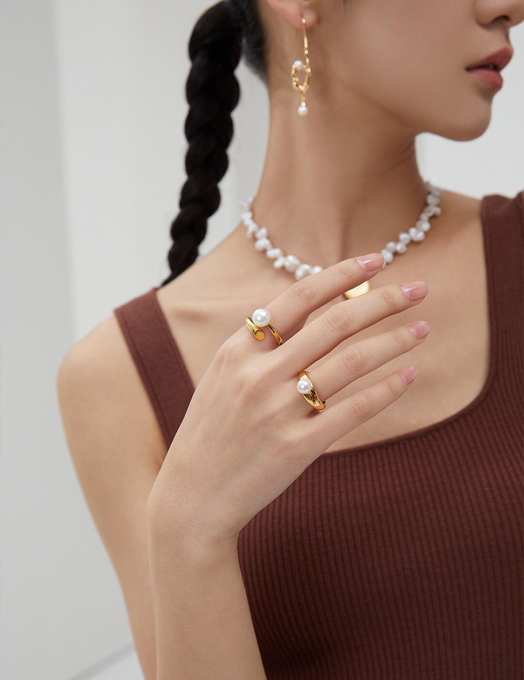 Model wearing Gold Vermeil Pearl Ring with matching pearl jewelry. Elegant and hypoallergenic accessory perfect for gifting or daily wear.