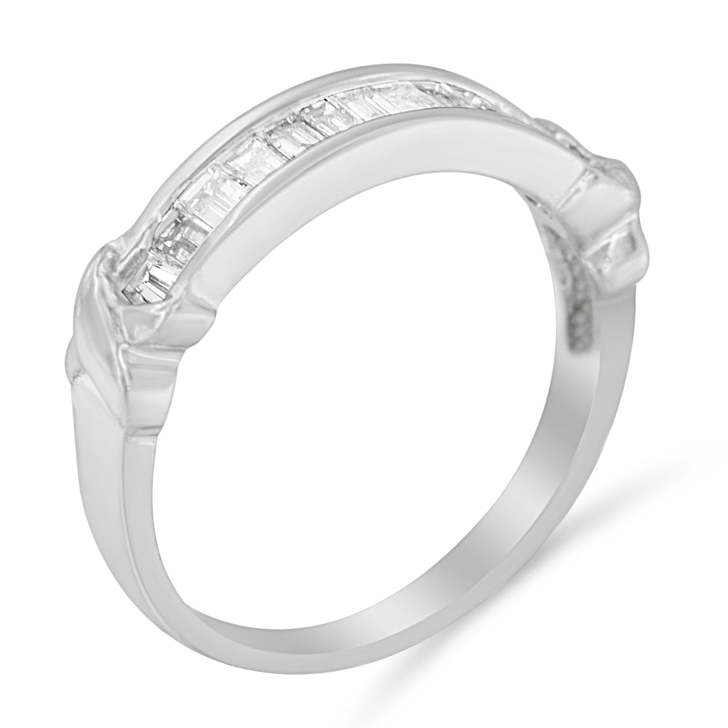 Sterling silver wedding ring with baguette cut diamonds in a half-station design. Elegant diamond band ideal for weddings or special occasions.