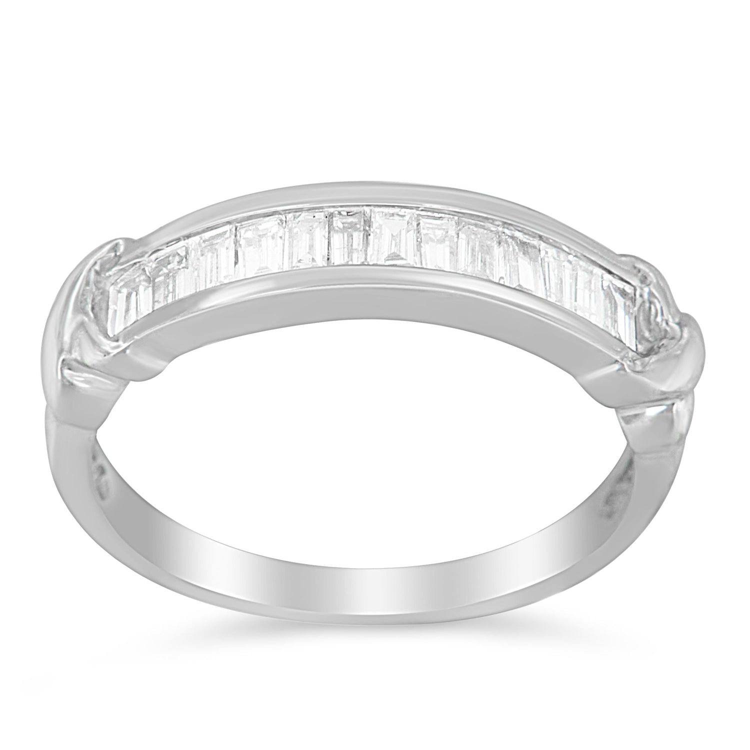 Sterling silver wedding ring with baguette cut diamonds in a half-station design. Elegant diamond band for fine jewelry and special occasions.