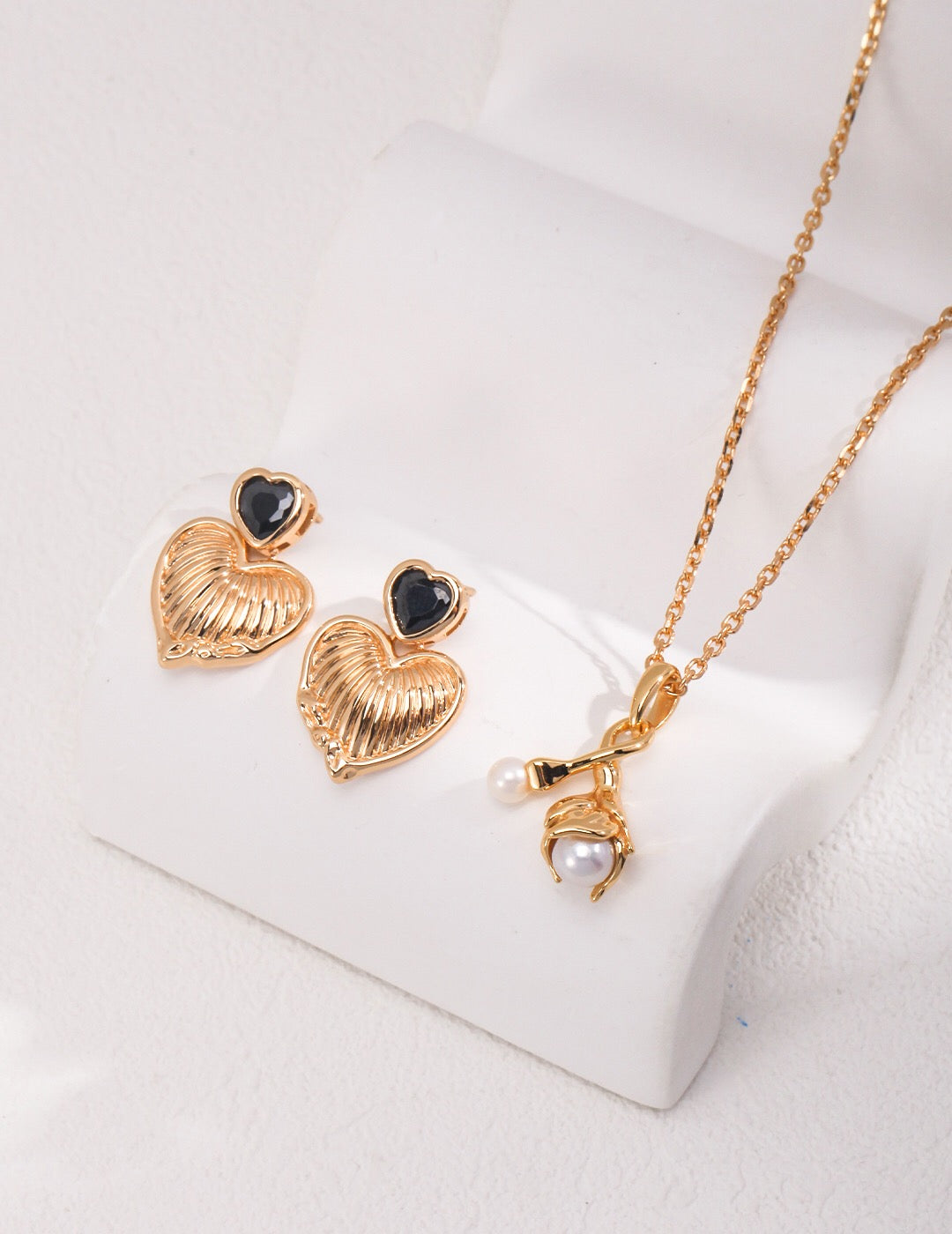 Gold Pearl Pendant Necklace paired with modern pearl ring. Handmade hypoallergenic jewelry with natural pearl and gold vermeil finish.