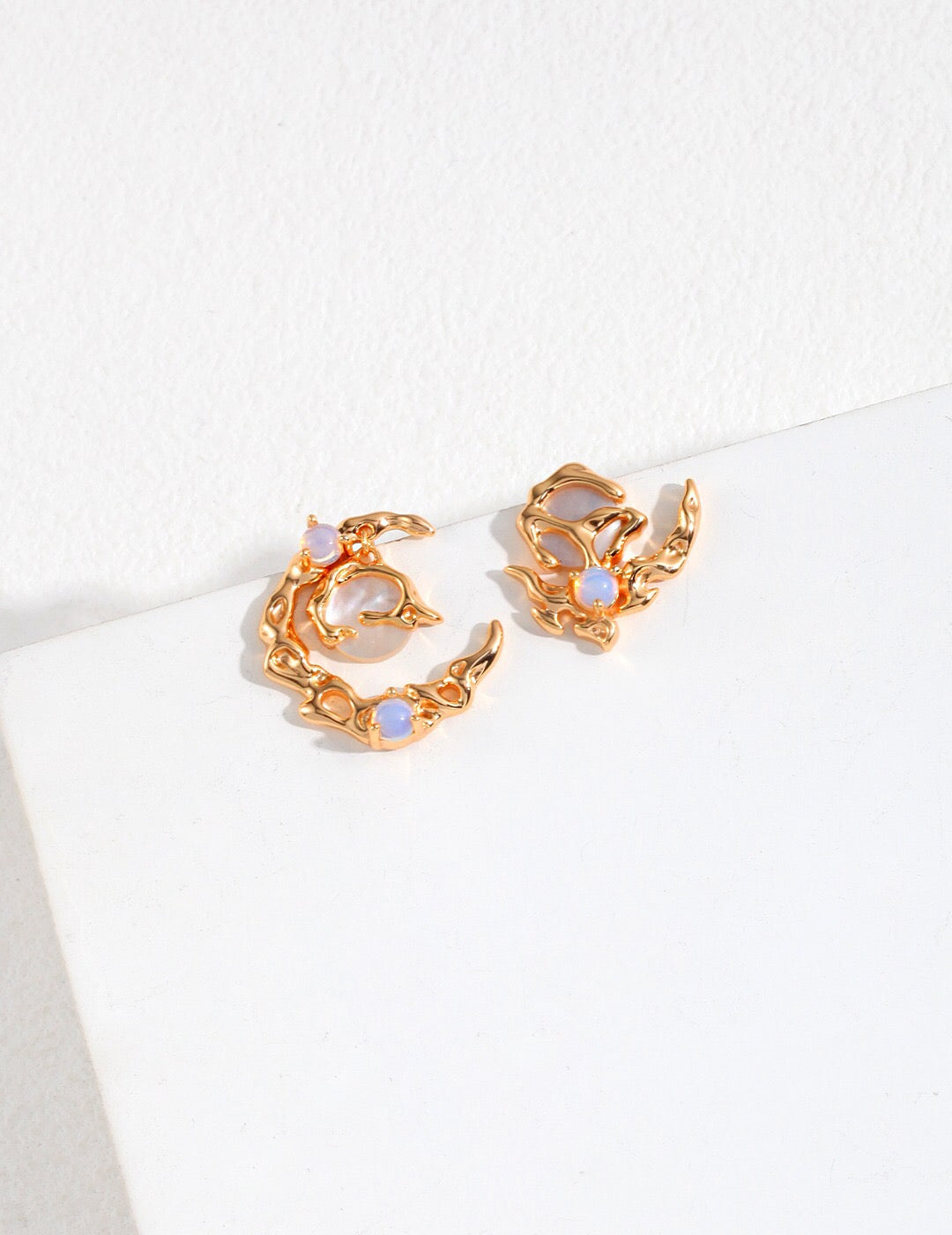 Crescent Moon Style Asymmetrical Opal Stud Earrings in 18k gold-plated finish with iridescent opals, perfect for celestial jewelry lovers.