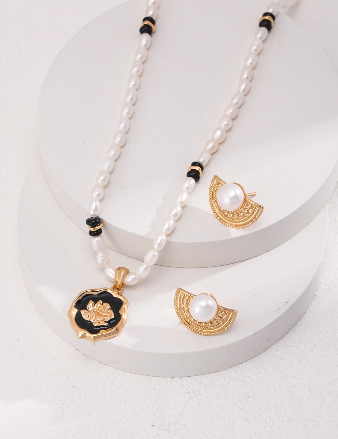Half Circle Pearl Stud Earrings paired with a matching pearl necklace, highlighting a coordinated jewelry set in gold-plated sterling silver.
