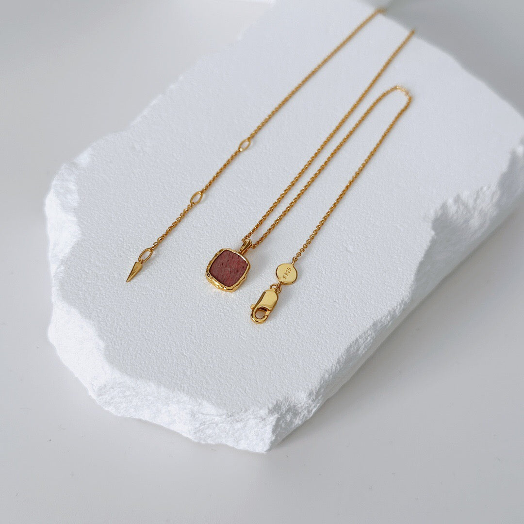 Close-up of Handmade Gold Healing Necklace with Rhodochrosite pendant and adjustable gold vermeil chain, showcasing clasp and detailing.