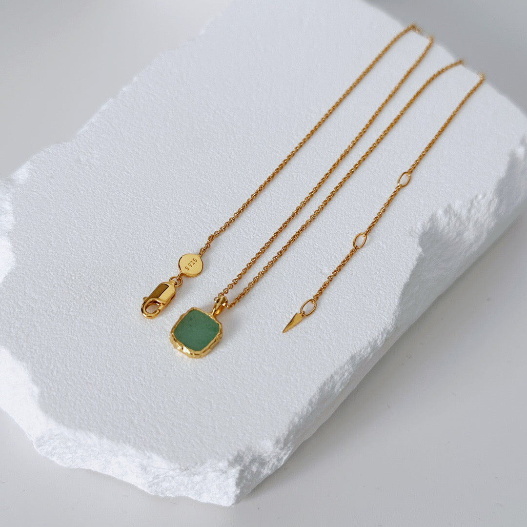 Green Aventurine pendant on Gold Healing Necklace with adjustable gold vermeil chain, laid flat to show clasp and fine chain accents.