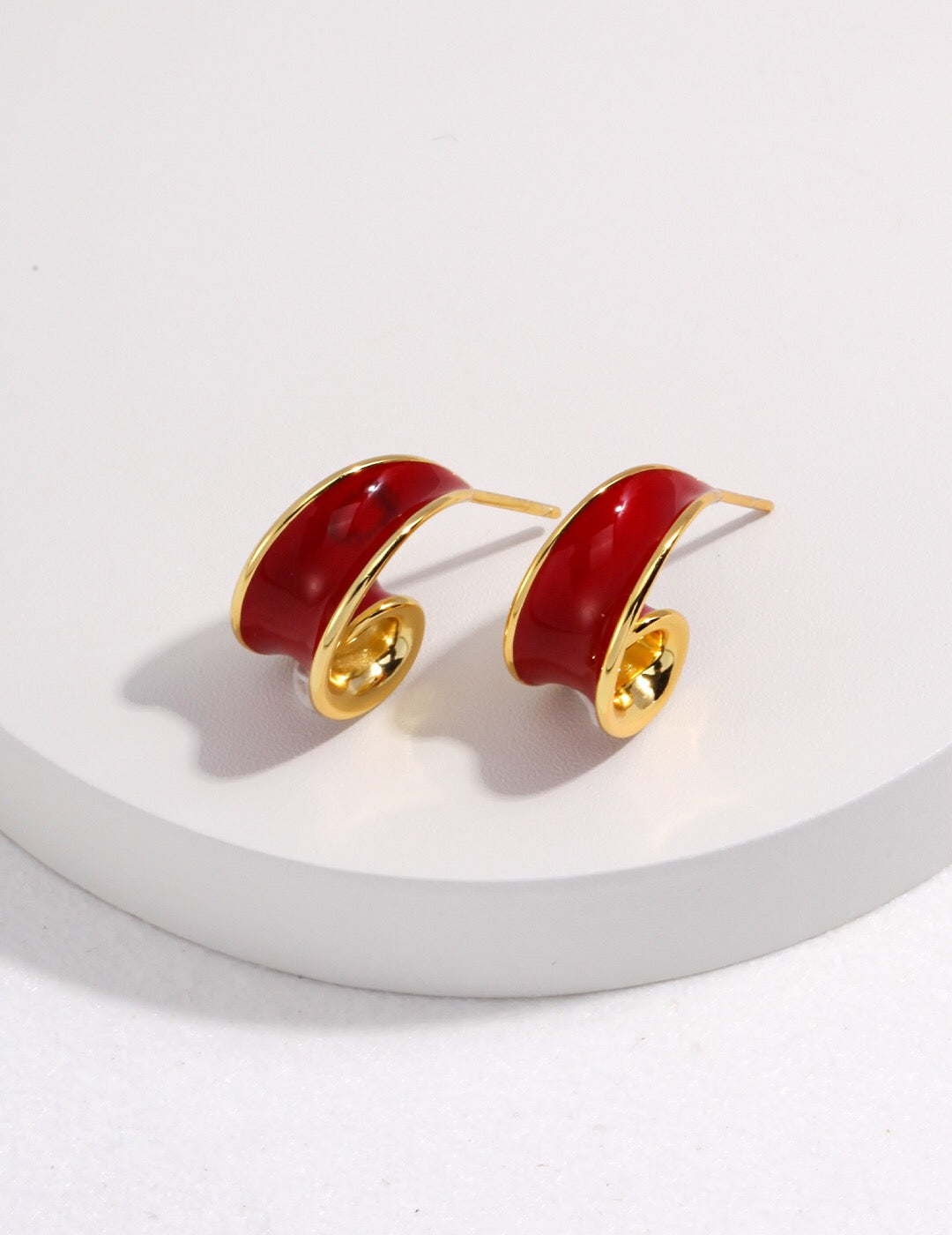 Helix Earrings - Drip Glaze Gold in red with a glossy finish and spiral hoop design, handmade and tarnish-free for modern elegance.