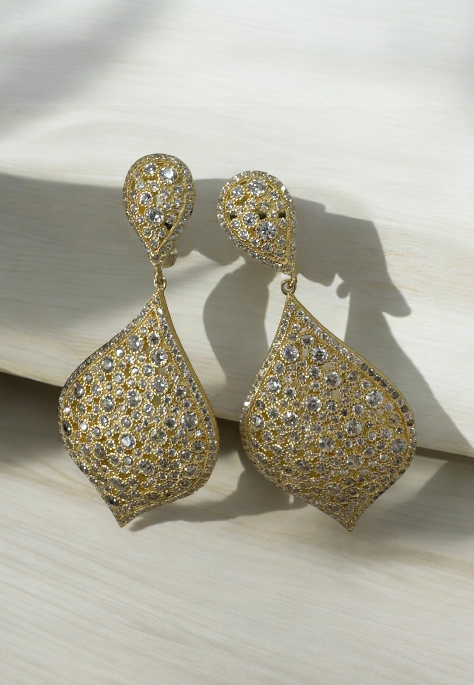 Arabian Nights Earrings Gold feature teardrop-shaped 22ct gold drop earrings encrusted with sparkling zircons, inspired by Taj Mahal elegance.