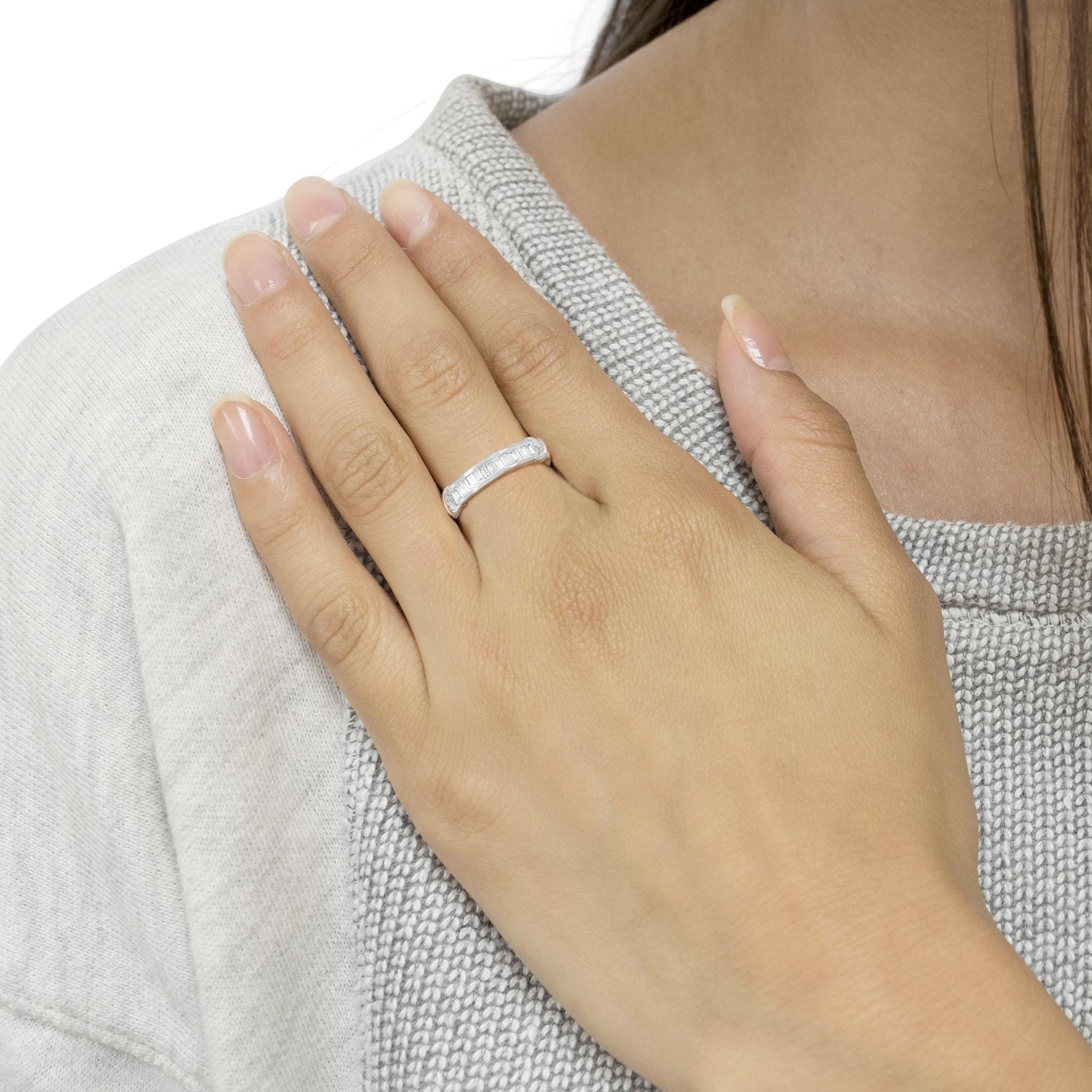 Sterling Silver Wedding Ring - Diamond Band worn on hand, showcasing its timeless elegance and baguette cut diamonds for fine jewelry lovers.
