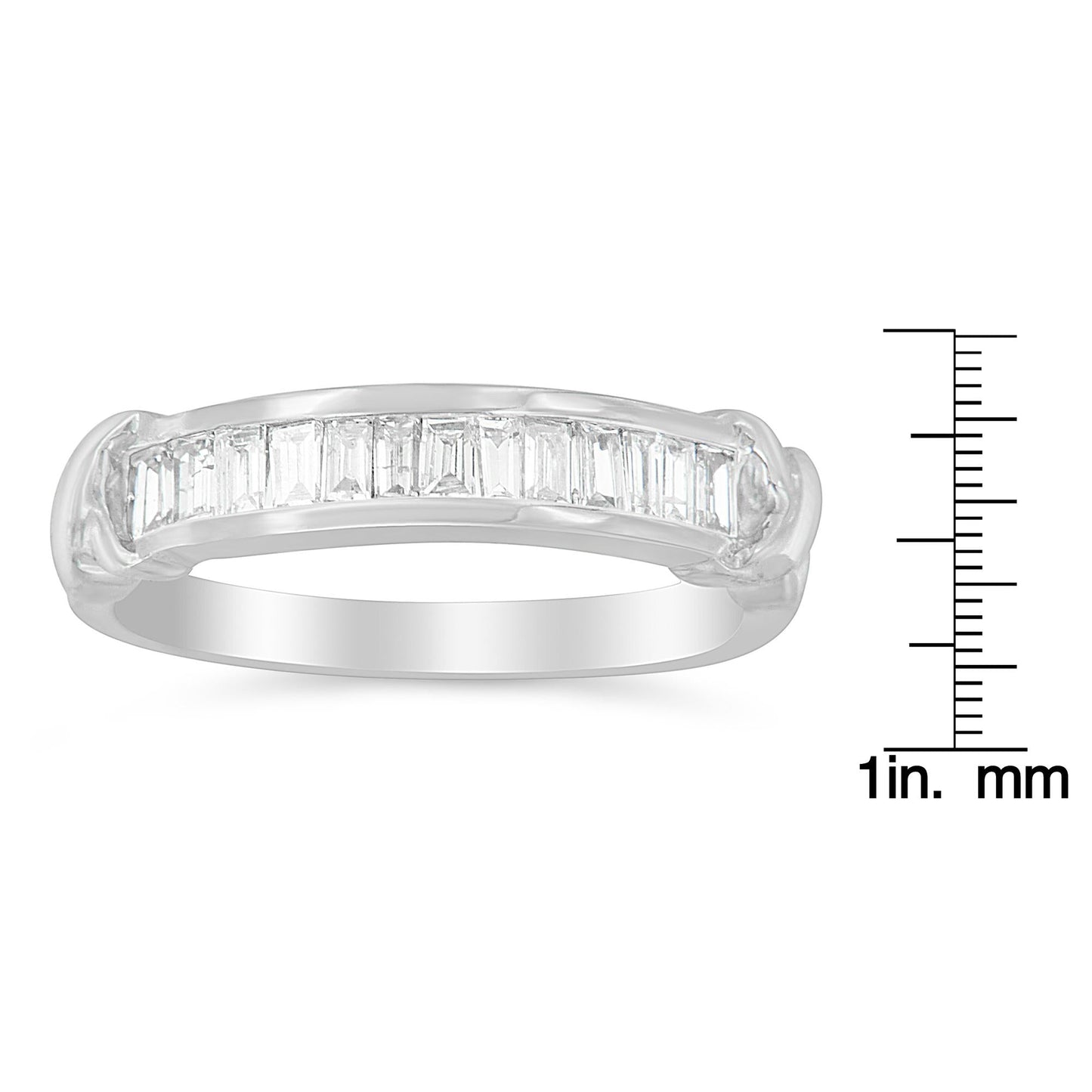 Sterling silver wedding ring with baguette cut diamonds in a half-station design. Elegant diamond band for fine jewelry and special occasions.