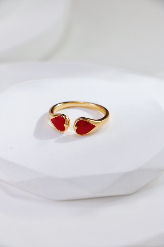 Heart Shaped Ring - Gold Vermeil Adjustable with dual red enamel hearts, tarnish-resistant and hypoallergenic, displayed on a white surface.