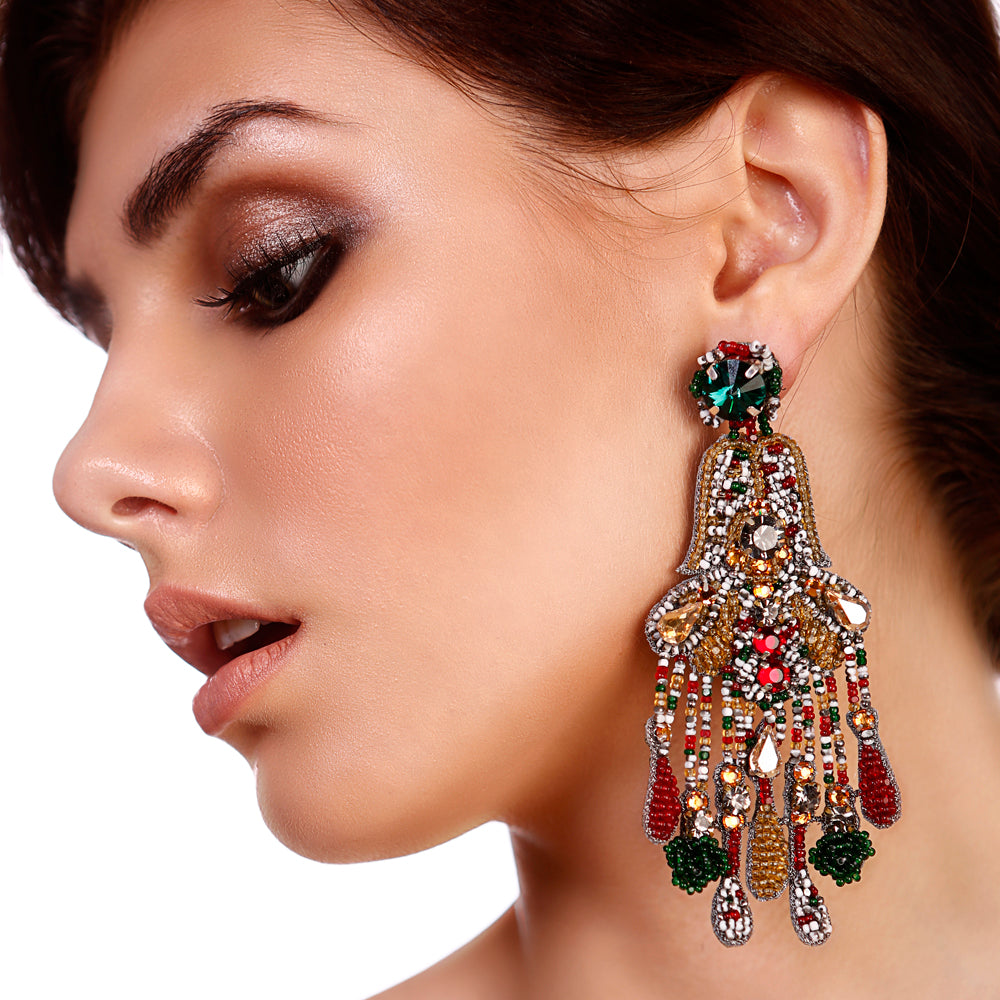 Model wearing Vintage Earrings - Emerald Chandelier, showcasing handcrafted Swarovski crystals and intricate detailing for premium festive style.