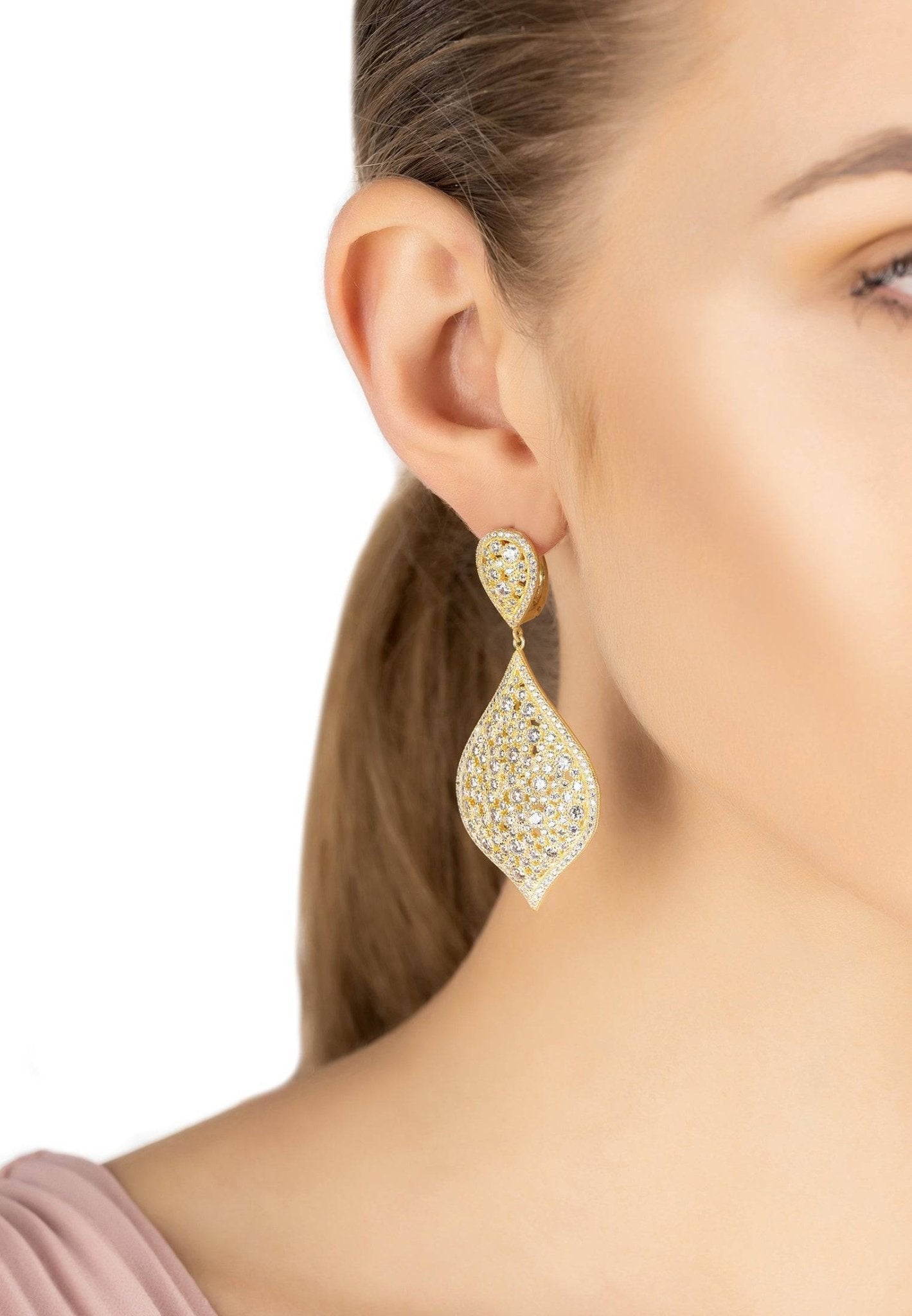 Arabian Nights Earrings Gold - Elegant Sparkle | 22ct Gold, Zircons shown worn on model. Teardrop-shaped drop earrings with intricate crystal detailing.