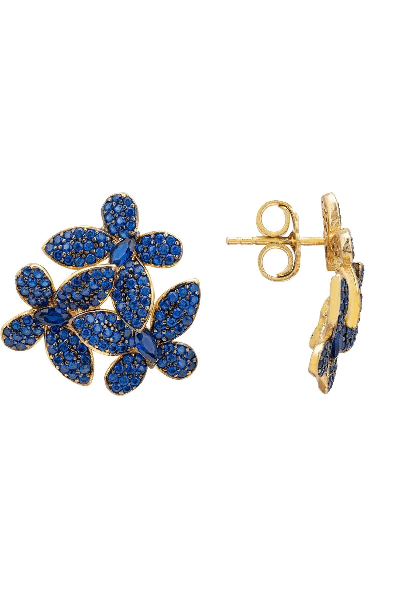 Close-up of sapphire blue floral stud earrings with gold posts, highlighting intricate zircon detailing and premium craftsmanship.